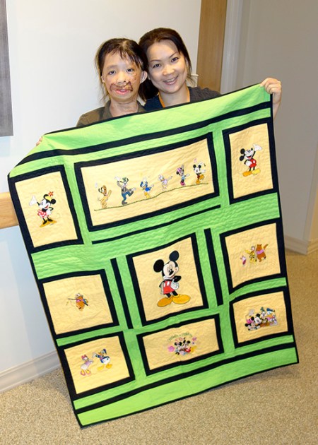 Boun Lod and Noi with blanket made by Annette